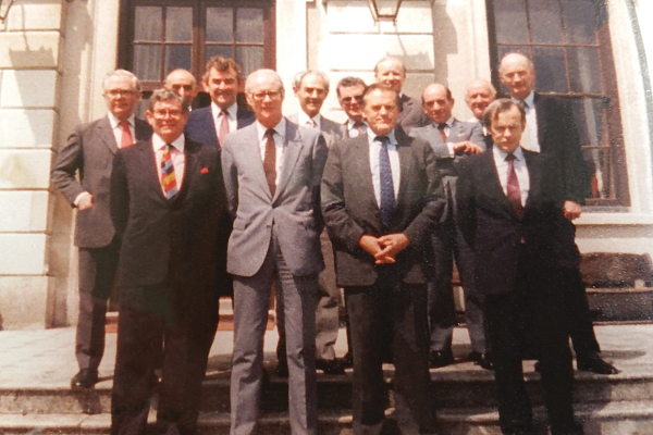 The negotiators at Chevening (Country residence of the British Foreign Secretary) April 1985. Front Row: Alan Goodison, UK Ambassador to Ireland; Dermot Nally, Secretary to Irish Government; Robert Armstrong, UK Cabinet Secretary; Noel Dorr, Irish Ambassador to UK. Second row: David Goodall, Deputy Permanent Secretary at Foreign and Commonwealth; Tony Brennan, Deputy Permanent Secretary, Northern Ireland; Seán Donlon, Secretary General, Irish Department of Foreign Affairs; Andrew Ward, Secretary General, Irish Department of Justice; Michael Lillis, Assistant Secretary General, Irish Dept. of Foreign Affairs; Tony Stevens, Deputy Permanent Secretary, NIO; Declan Quigley, Secretary General, Irish Attorney General’s Office; Christopher Mallaby, Deputy Secretary to UK Cabinet. Back row: Henry Darwin, Legal Adviser at the FCO. (Absent: Sir Robert Andrew, Permanent Under Secretary NIO) 